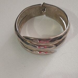 Brutalist Silver-Toned Metal Cuff Bracelet with Spring Closure